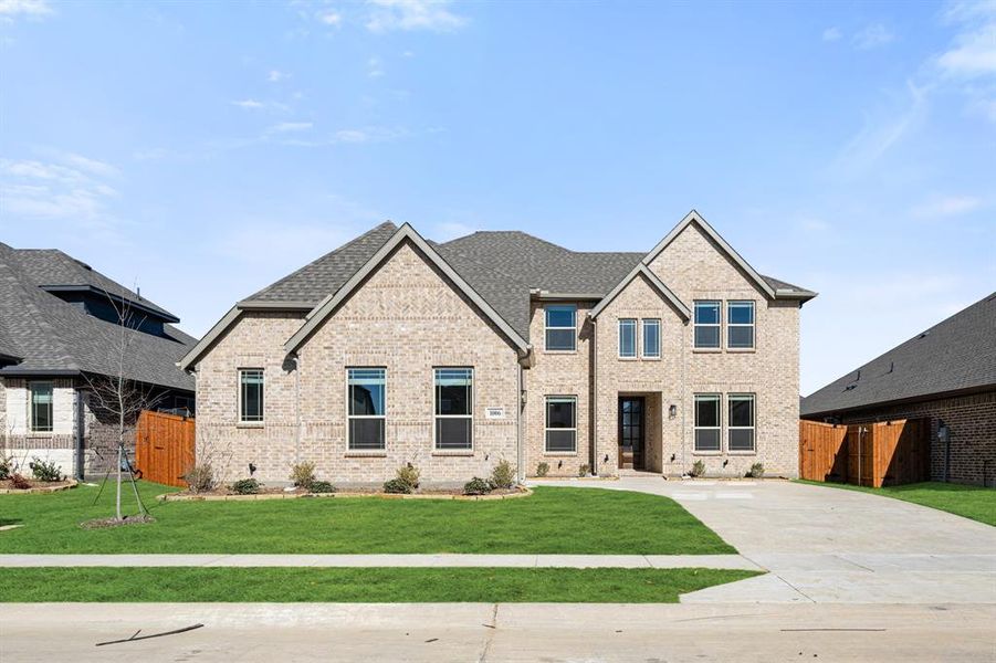 Front exterior of a new home in Timberbrook, Justin, TX, highlighting curb appeal (Image 2).