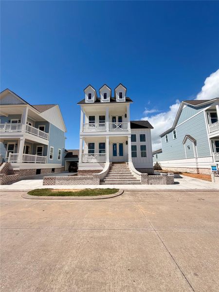 Front exterior of a new home in , Galveston, TX, highlighting curb appeal (Image 13).