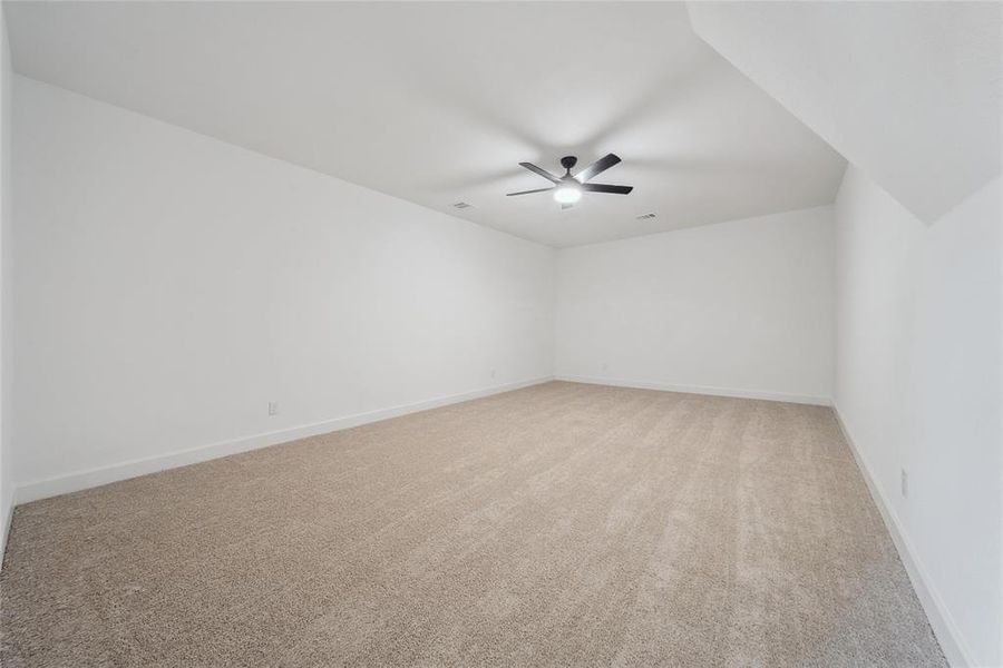 Media/game room (2nd floor) with carpet and ceiling fan