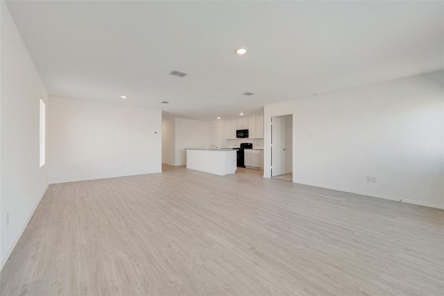 Unfurnished living room with light hardwood / wood-style flooring