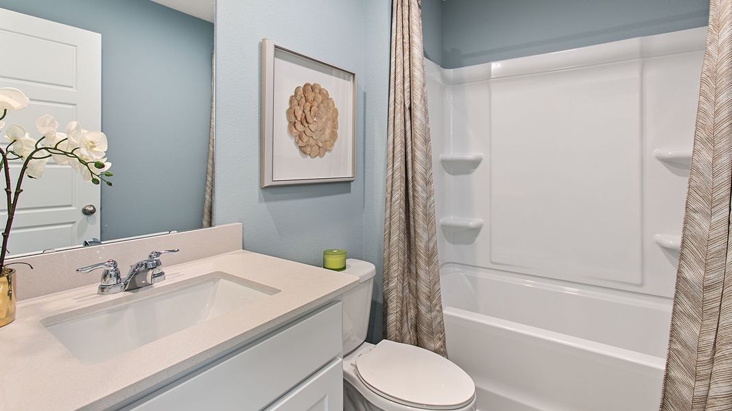 Representative furnished interior of a home built from the HAYDEN II by D.R. Horton in Copes Landing, Jacksonville (Image 17).