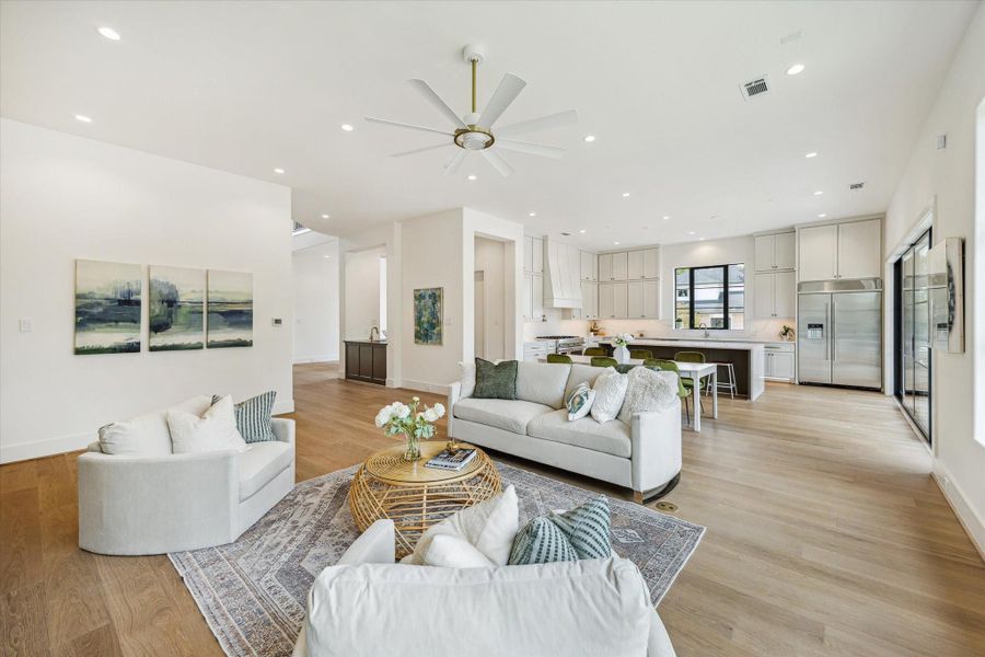 Living, casual dining and kitchen have an open flow plan and access to entertaining bar off of the formal dining room.