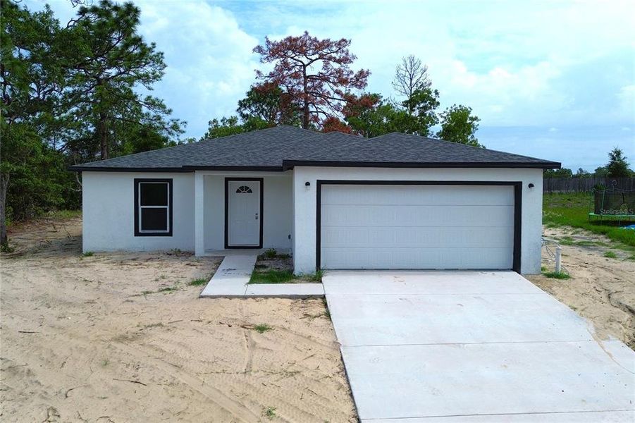 Front exterior of a new home in , Spring Hill, FL, highlighting curb appeal (Image 22).