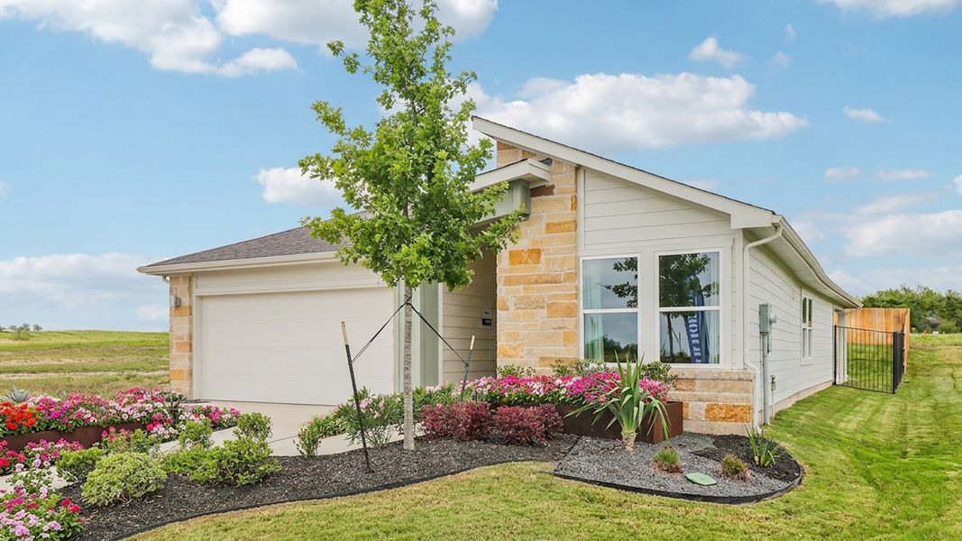 Representative exterior photo of a completed home built from the The Forest by D.R. Horton in Trails at Wildhorse, Austin, TX (Image 22).