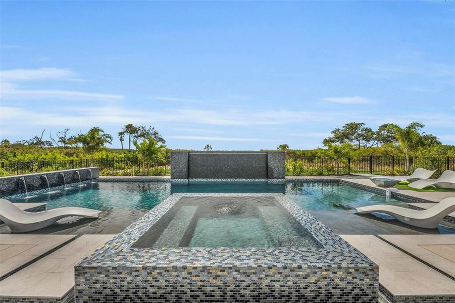 Tranquil water features adorn the pool.