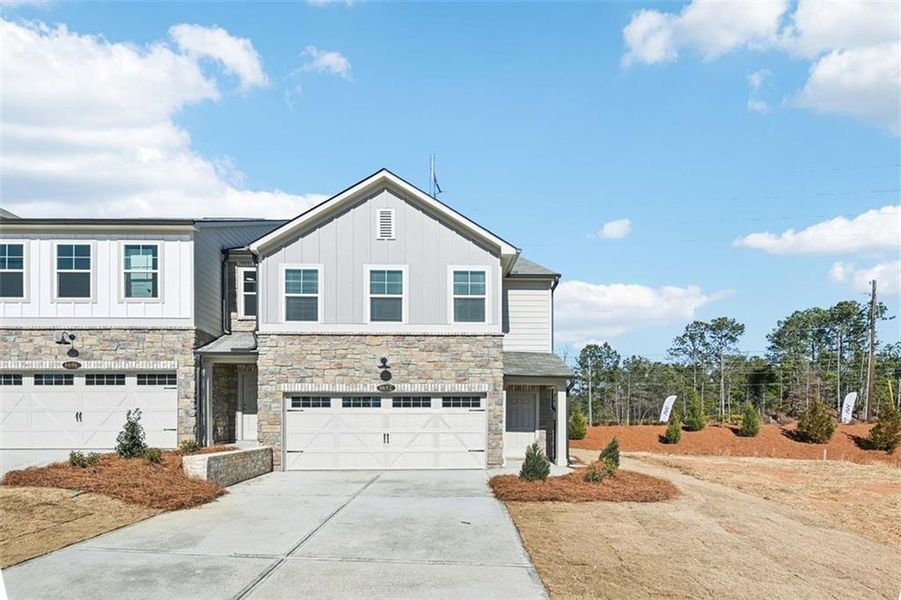 Front exterior of a new home in Leydenview, Mableton, GA, highlighting curb appeal (Image 19). Front exterior of a new home in Leydenview, Mableton, GA, highlighting curb appeal (Image 19).