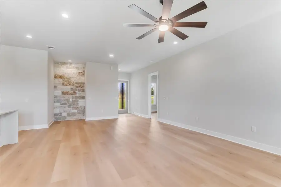 Spare room featuring a ceiling fan, light wood finished floors, and recessed lighting