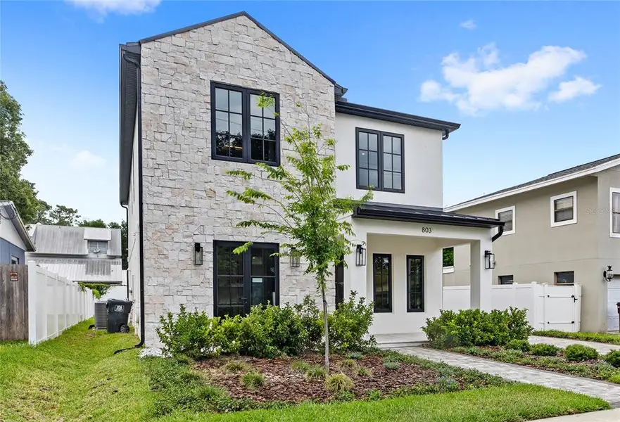 Front exterior of a new home in , Orlando, FL, highlighting curb appeal (Image 1). Front exterior of a new home in , Orlando, FL, highlighting curb appeal (Image 1).