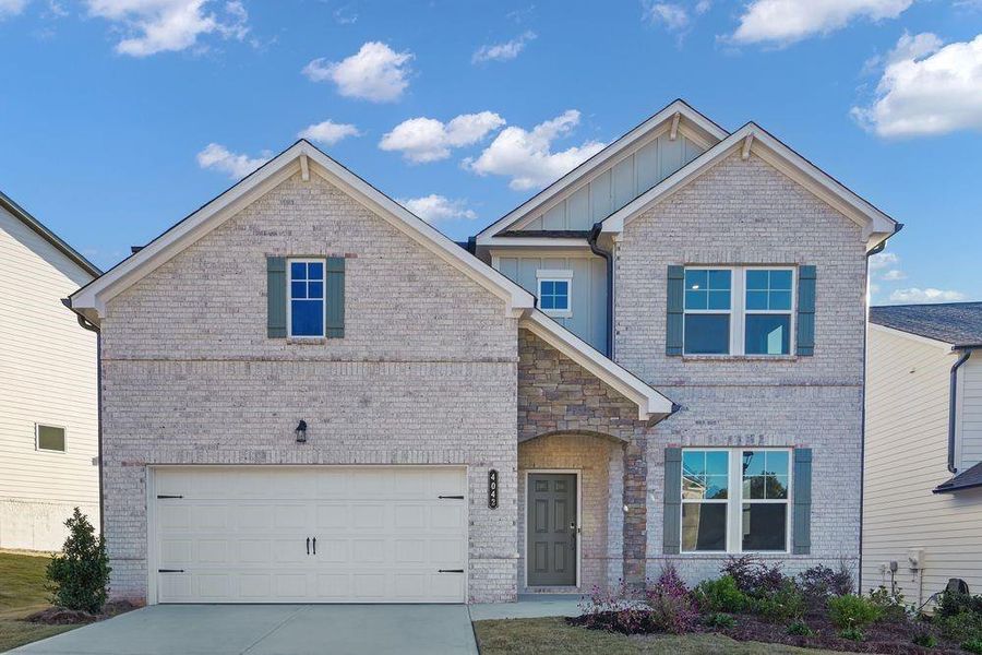 Front exterior of a new home in Falls Creek, Flowery Branch, GA, highlighting curb appeal (Image 1). Front exterior of a new home in Falls Creek, Flowery Branch, GA, highlighting curb appeal (Image 1).
