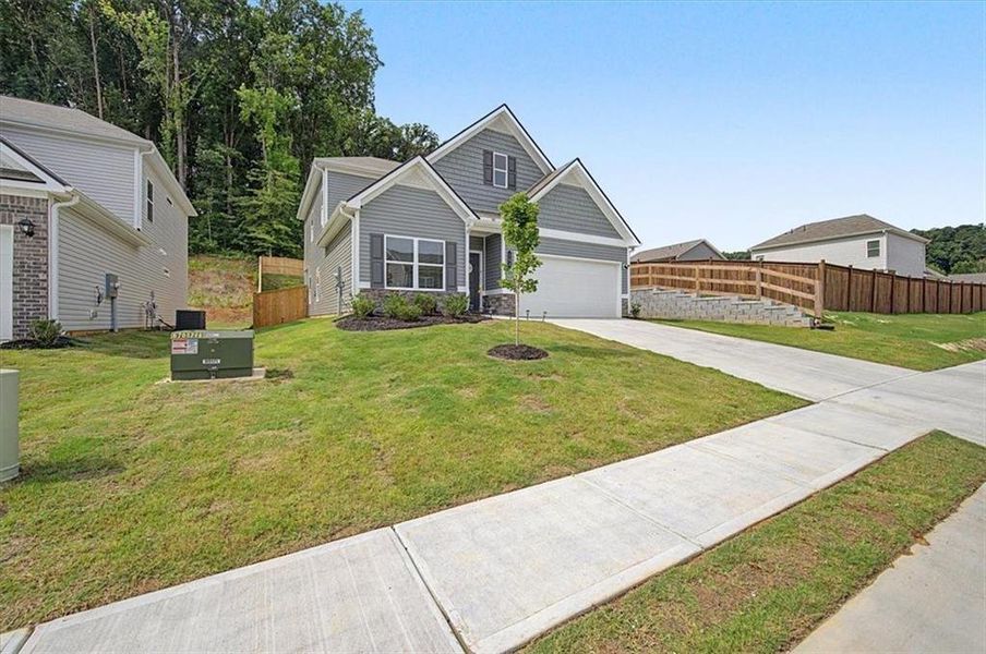 Front exterior of a new home in , Calhoun, GA, highlighting curb appeal (Image 2). Front exterior of a new home in , Calhoun, GA, highlighting curb appeal (Image 2).