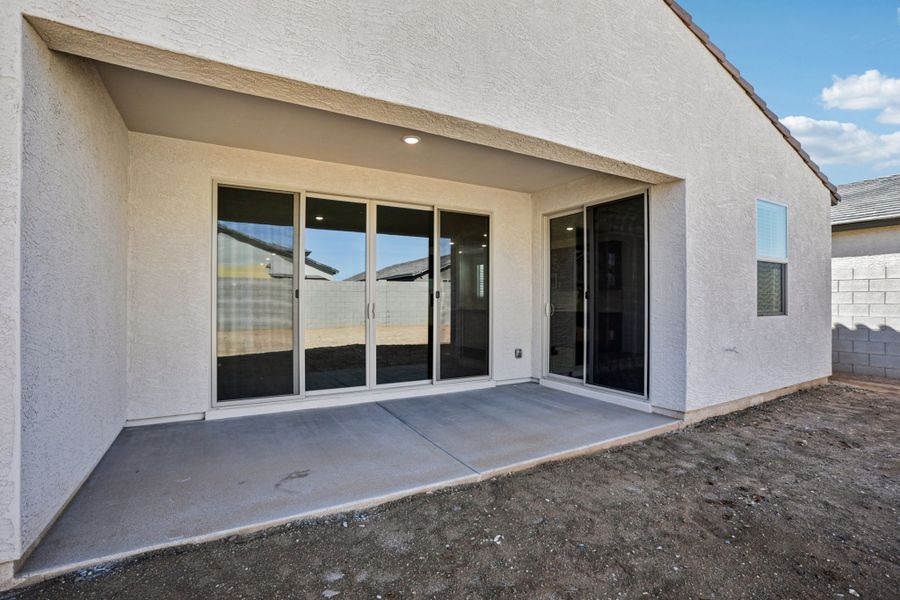 Covered patio - Sanctuary at Stonebridge Model Home. Finishes and options may vary by community