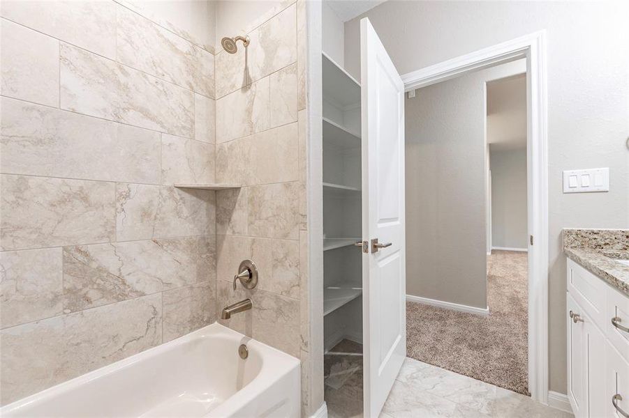 Tile surround and linen closet