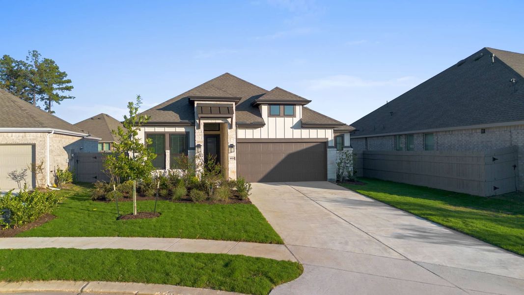 Front exterior of a new home in Artavia, Conroe, TX, highlighting curb appeal (Image 18). Front exterior of a new home in Artavia, Conroe, TX, highlighting curb appeal (Image 18).