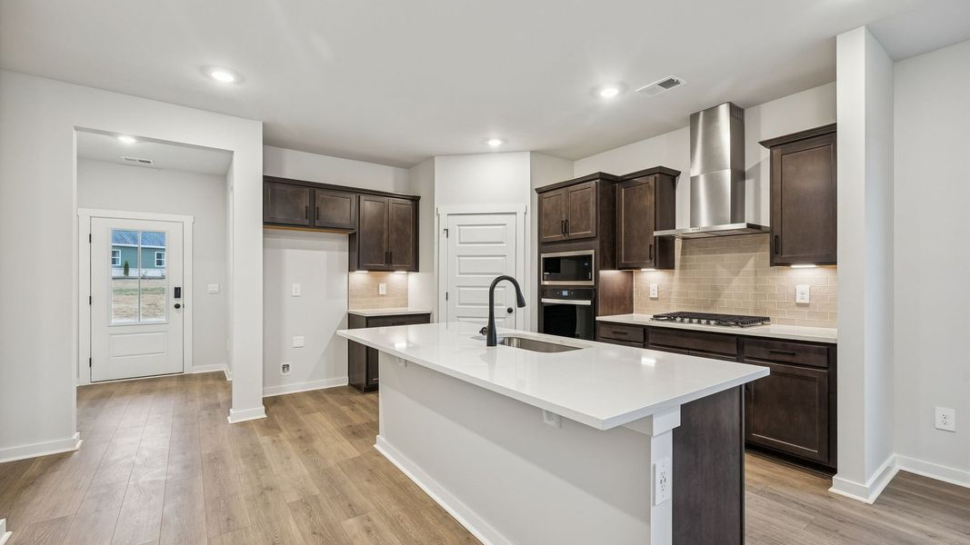 Representative furnished interior of a home built from the Dijon B by D.R. Horton in Harvest Point, Spring Hill (Image 15). Representative furnished interior of a home built from the Dijon B by D.R. Horton in Harvest Point, Spring Hill (Image 15).