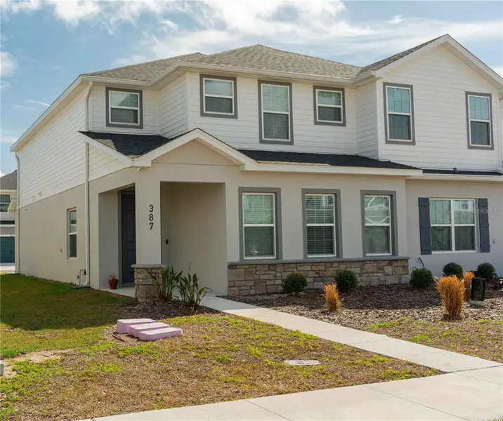 Front exterior of a new home in , St. Cloud, FL, highlighting curb appeal (Image 28). Front exterior of a new home in , St. Cloud, FL, highlighting curb appeal (Image 28).