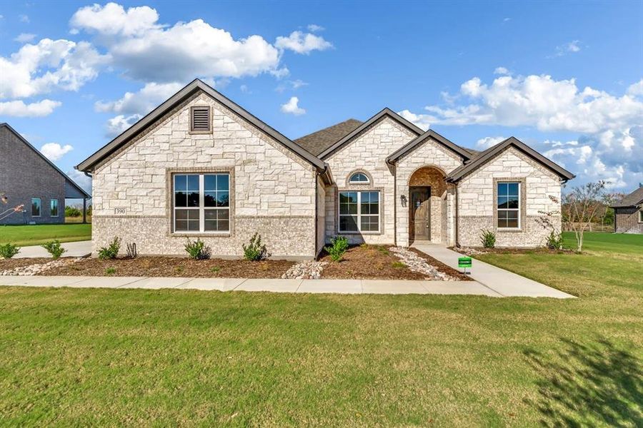 Front exterior of a new home in Fannin Ranch, Leonard, TX, highlighting curb appeal (Image 2). Front exterior of a new home in Fannin Ranch, Leonard, TX, highlighting curb appeal (Image 2).