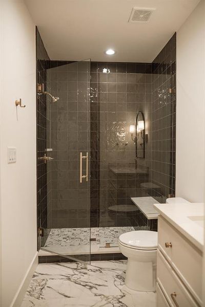 Full bath featuring vanity, a stall shower, recessed lighting, and marble finish flooring Full bath featuring vanity, a stall shower, recessed lighting, and marble finish flooring