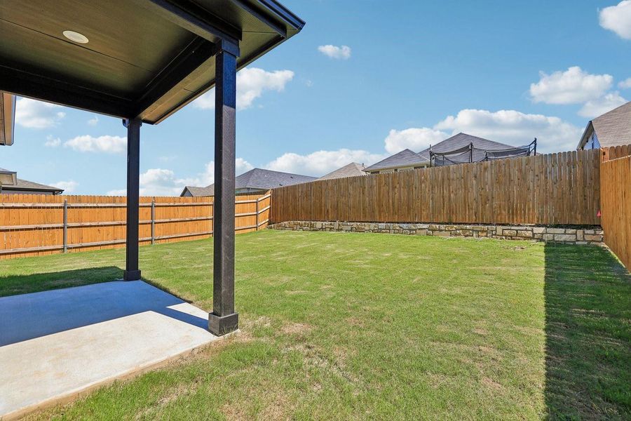 Exterior details and patio area of a home in Trinity Ranch, Elgin (Image 3).
