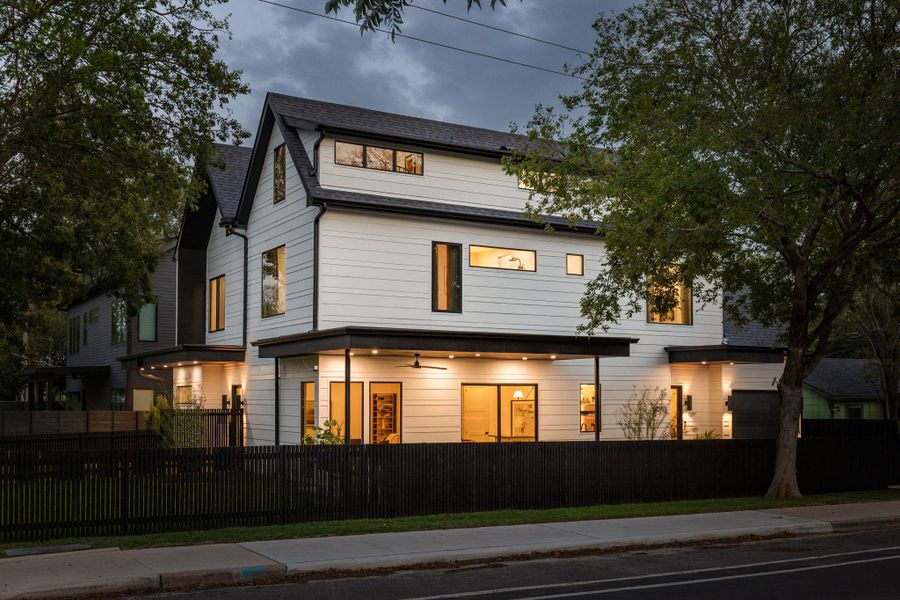 Rear view of property with a fenced front yard