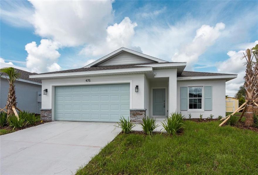 Front exterior of a new home in , Port Charlotte, FL, highlighting curb appeal (Image 1).