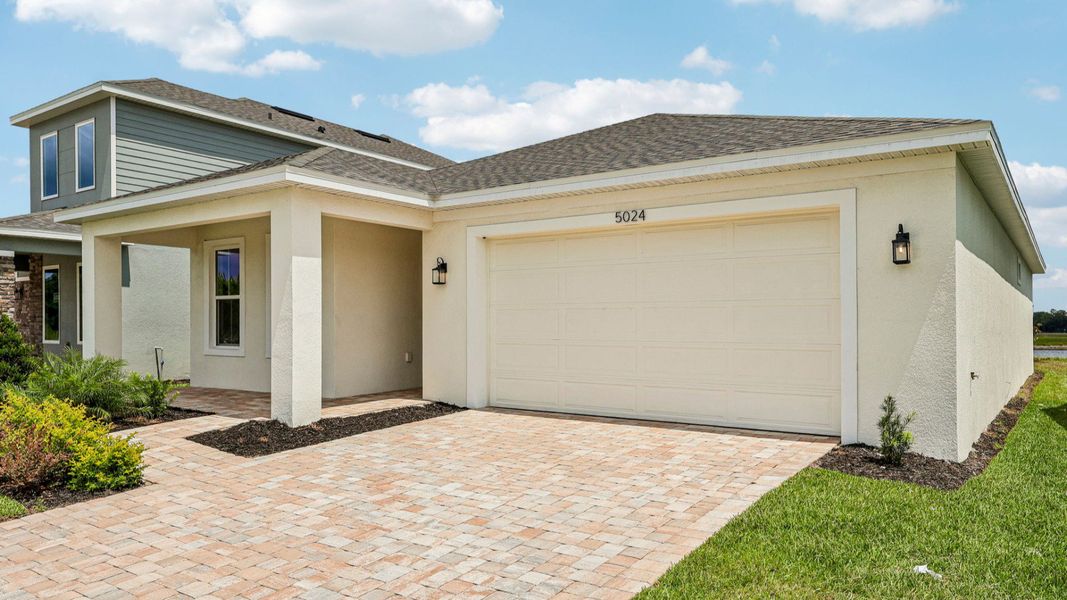 Representative exterior photo of a completed home built from the Buttonwood by DRB Homes in Ardisia Park, New Smyrna Beach, FL (Image 27).