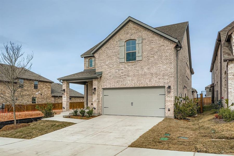 Front exterior of a new home in Hillstead, Lavon, TX, highlighting curb appeal (Image 2).