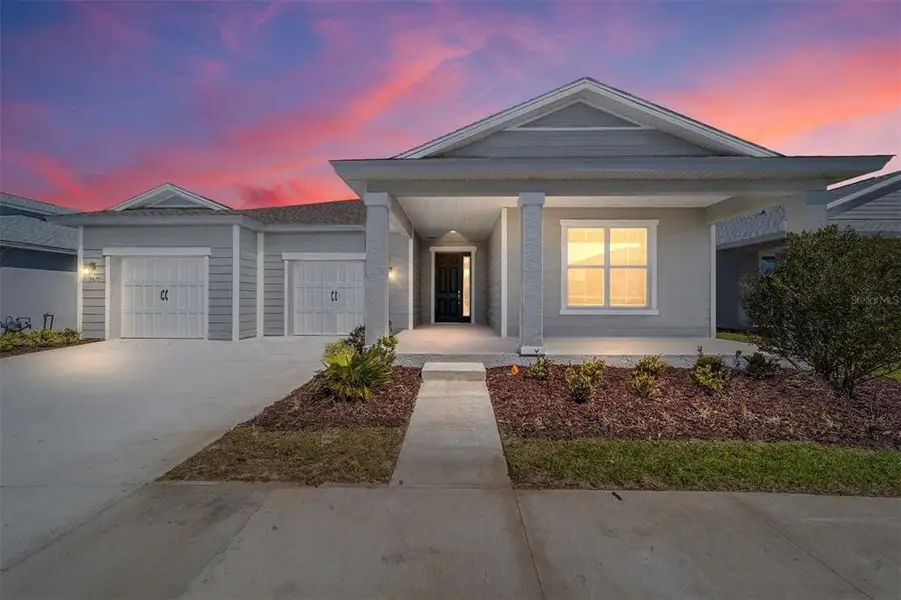 Front exterior of a new home in Calesa Township, Ocala, FL, highlighting curb appeal (Image 1). Front exterior of a new home in Calesa Township, Ocala, FL, highlighting curb appeal (Image 1).