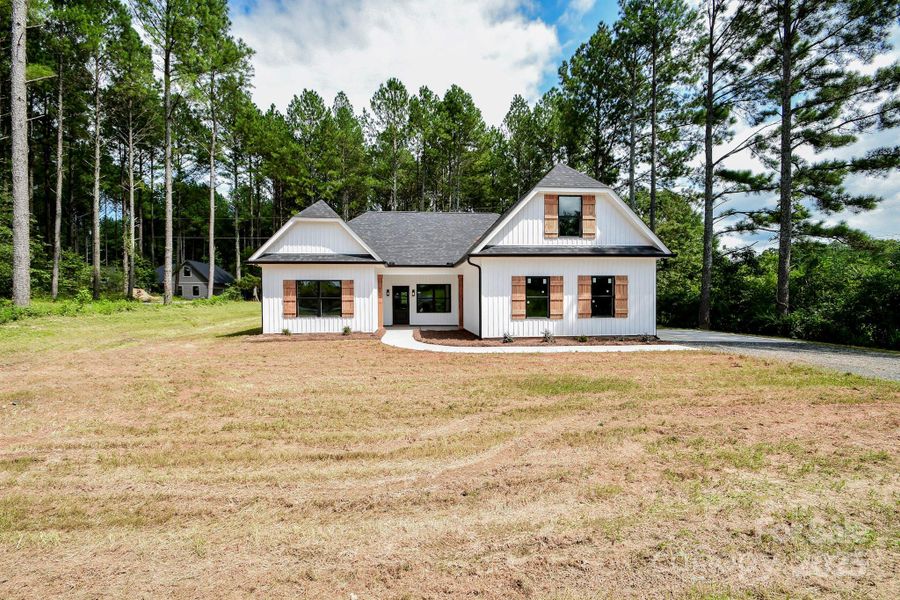 Front exterior of a new home in , Marshville, NC, highlighting curb appeal (Image 21).