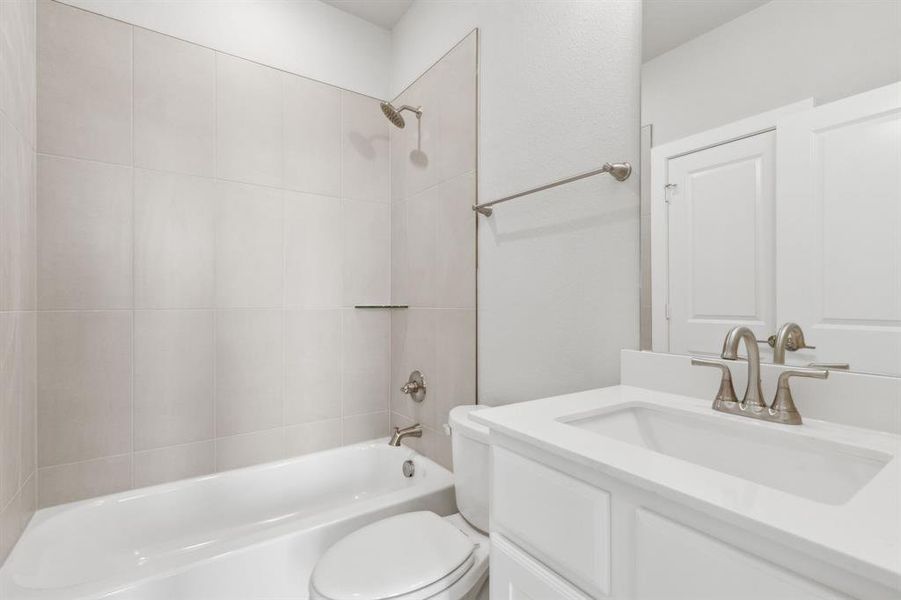 Full bathroom featuring shower combination and vanity Full bathroom featuring shower combination and vanity