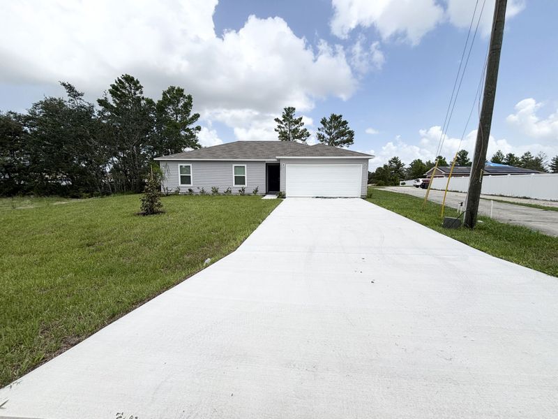Front exterior of a new home in Poinciana, Kissimmee, FL, highlighting curb appeal (Image 12). Front exterior of a new home in Poinciana, Kissimmee, FL, highlighting curb appeal (Image 12).