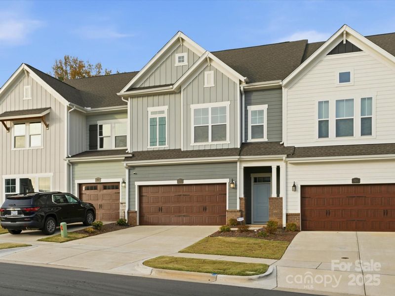 Front exterior of a new home in , Cornelius, NC, highlighting curb appeal (Image 2).