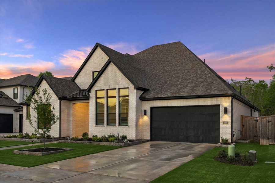 Front exterior of a new home in , Fulshear, TX, highlighting curb appeal (Image 2). Front exterior of a new home in , Fulshear, TX, highlighting curb appeal (Image 2).