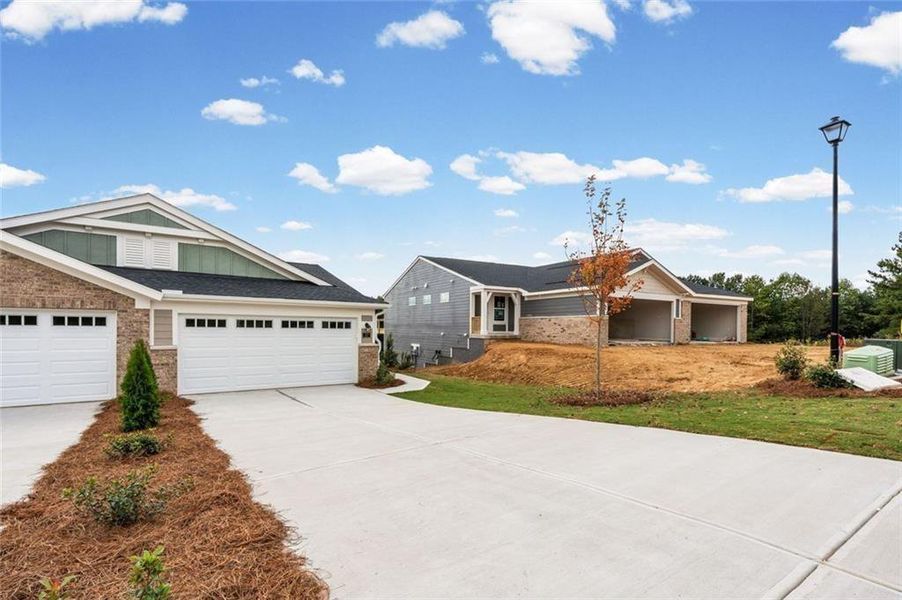 Front exterior of a new home in Villas at Gold Creek, Dawsonville, GA, highlighting curb appeal (Image 23).