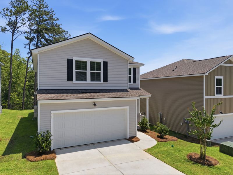 Front exterior of a new home in Grand Arbor, Blythewood, SC, highlighting curb appeal (Image 2). Front exterior of a new home in Grand Arbor, Blythewood, SC, highlighting curb appeal (Image 2).