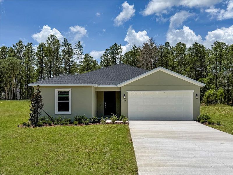 Front exterior of a new home in Marion Ranch, Ocala, FL, highlighting curb appeal (Image 1). Front exterior of a new home in Marion Ranch, Ocala, FL, highlighting curb appeal (Image 1).