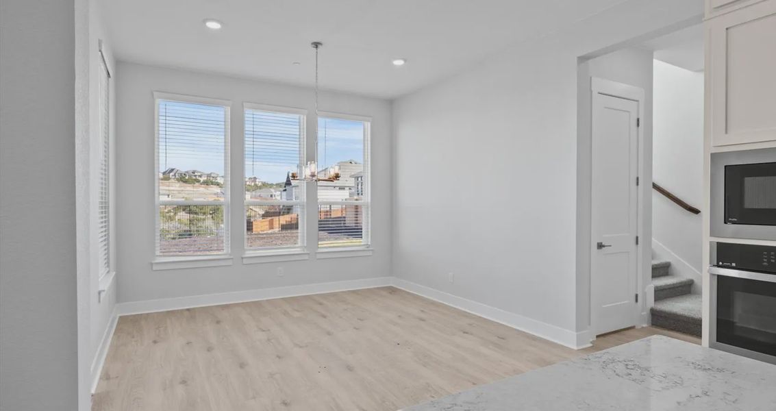 Representative unfurnished interior of a home built from the Raegan by Chesmar Homes in Sweetwater, Austin (Image 9).