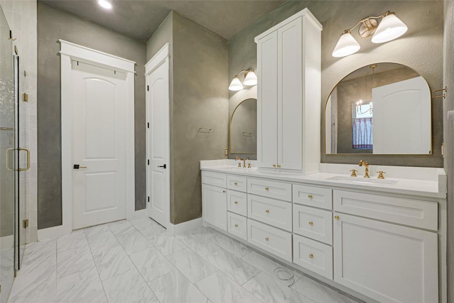 Primary Restroom with double sinks and lots of storage