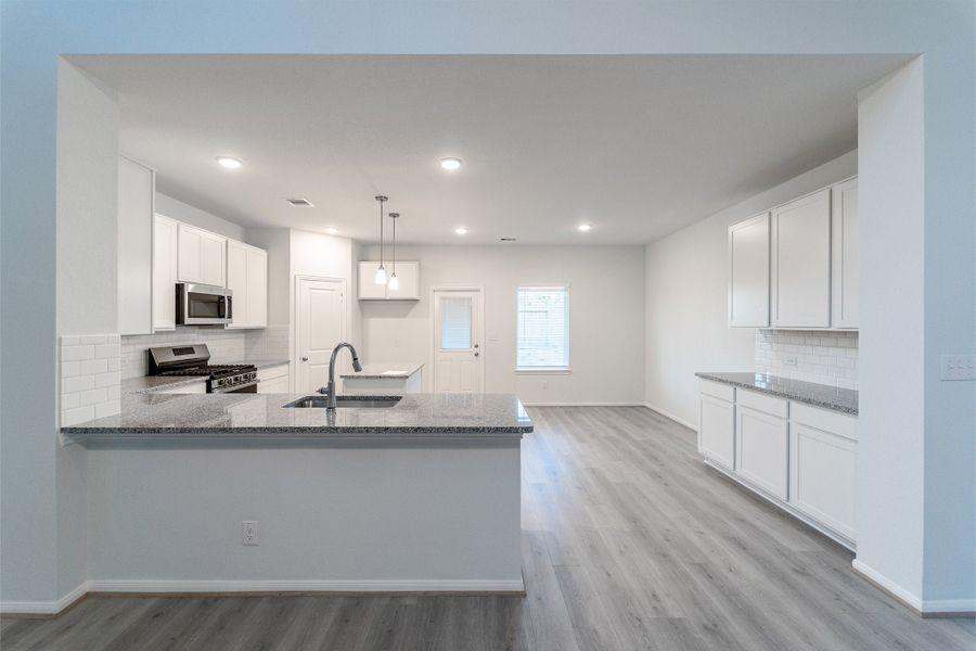 Furnished interior view inside a new home in Caney Mills, Conroe (Image 5).