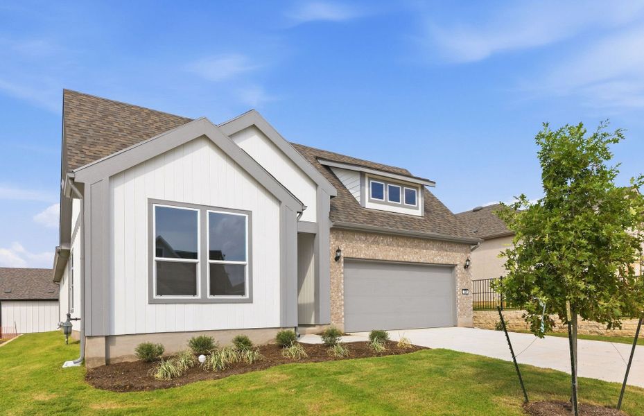 Front exterior of a new home in Sun City Texas, Georgetown, TX, highlighting curb appeal (Image 2). Front exterior of a new home in Sun City Texas, Georgetown, TX, highlighting curb appeal (Image 2).
