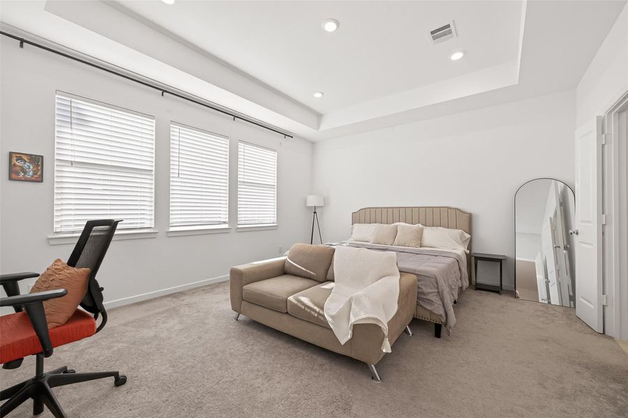 The primary bedroom serves as a serene retreat—an ideal place to relax and unwind. Thoughtfully designed with a spacious layout and calming ambiance, it provides a private haven for rest and comfort, making it the perfect place to recharge at the end of each day.