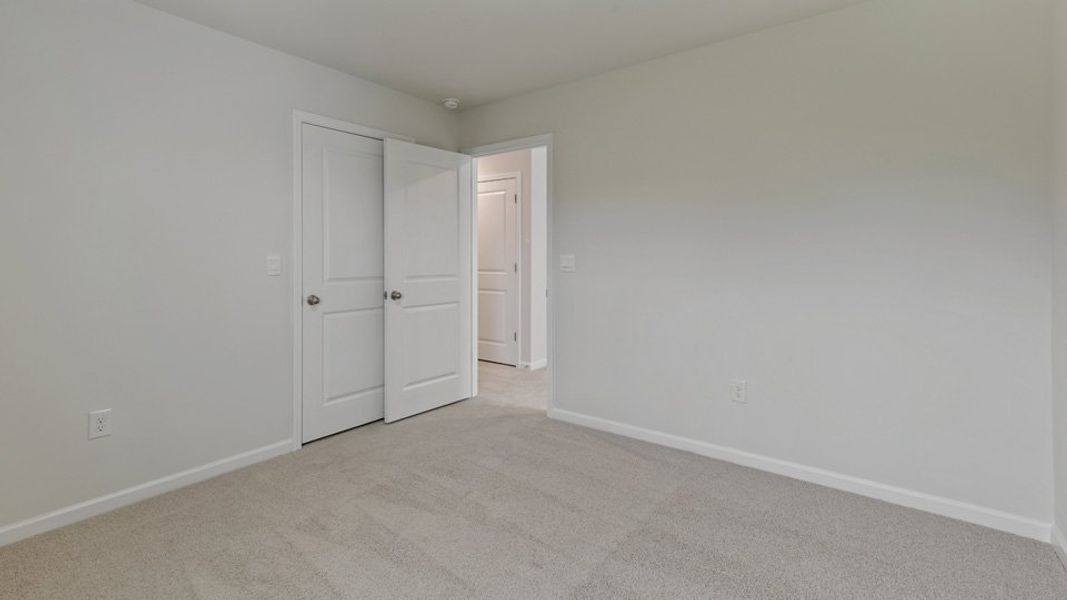 Spacious, unfurnished interior of a new home in The Grove at Matthews Landing, Fuquay Varina (Image 17).