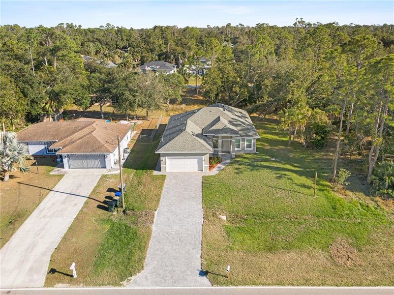 Front exterior of a new home in , North Port, FL, highlighting curb appeal (Image 1).