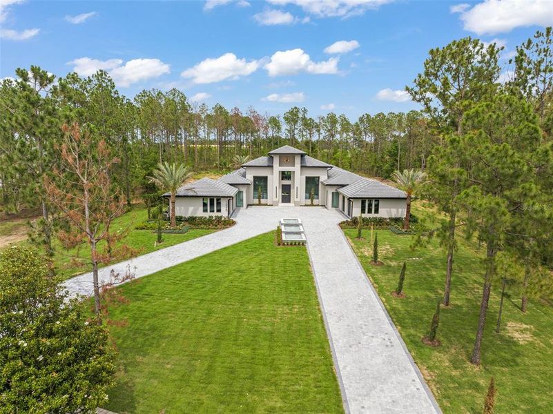 Front exterior of a new home in , Montverde, FL, highlighting curb appeal (Image 26).