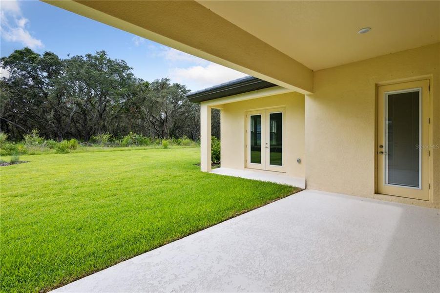 Front exterior of a new home in Triple Creek, Riverview, FL, highlighting curb appeal (Image 21).