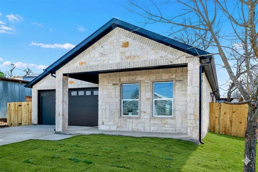 Front exterior of a new home in , Greenville, TX, highlighting curb appeal (Image 1). Front exterior of a new home in , Greenville, TX, highlighting curb appeal (Image 1).