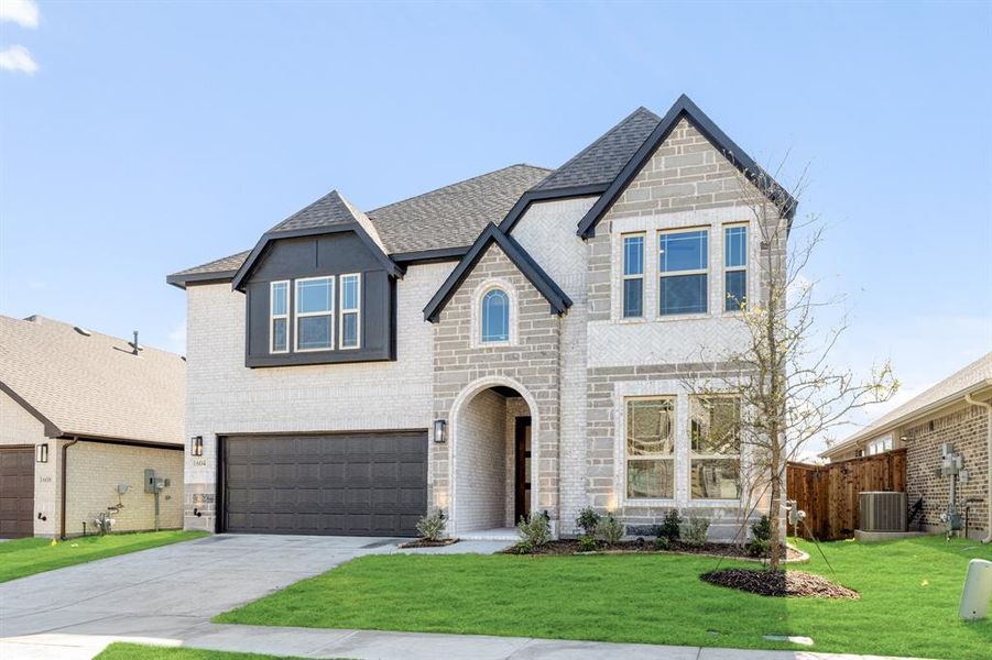 Front exterior of a new home in Willow Wood Classic 50, McKinney, TX, highlighting curb appeal (Image 1).