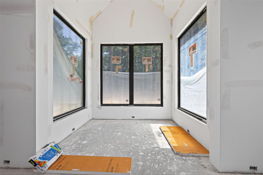 10x7 sitting area with vaulted ceilings and plenty of natural light