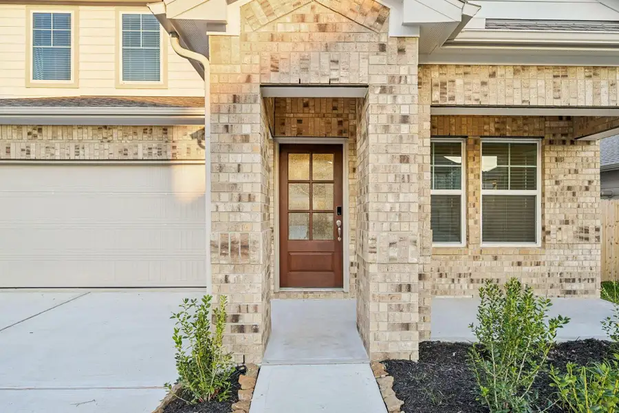 Exterior details and patio area of a home in Landing Meadows - Premier Series, New Caney (Image 4).