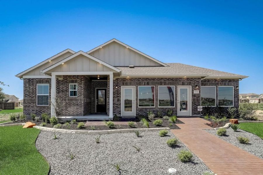 Front exterior of a new home in Village at Three Oaks, Seguin, TX, highlighting curb appeal (Image 2). Front exterior of a new home in Village at Three Oaks, Seguin, TX, highlighting curb appeal (Image 2).