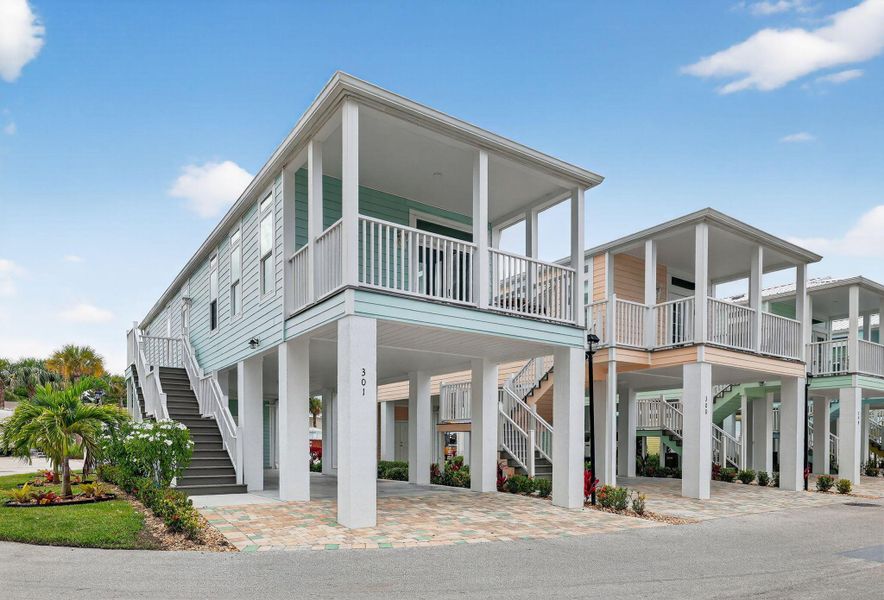 Front exterior of a new home in , Jensen Beach, FL, highlighting curb appeal (Image 21).